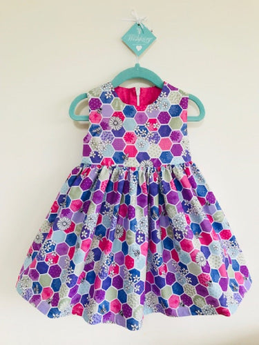 The Wishfairy Bunty Baby Dress (Bee Hexagons Pink)