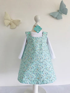 The Wishfairy Reversible Pixie Pinafore Baby Dress (Magnolia Flowers on Mint)