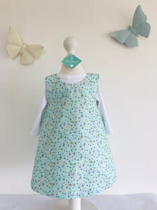 The Wishfairy Reversible Pixie Pinafore Baby Dress (Magnolia Flowers on Mint)